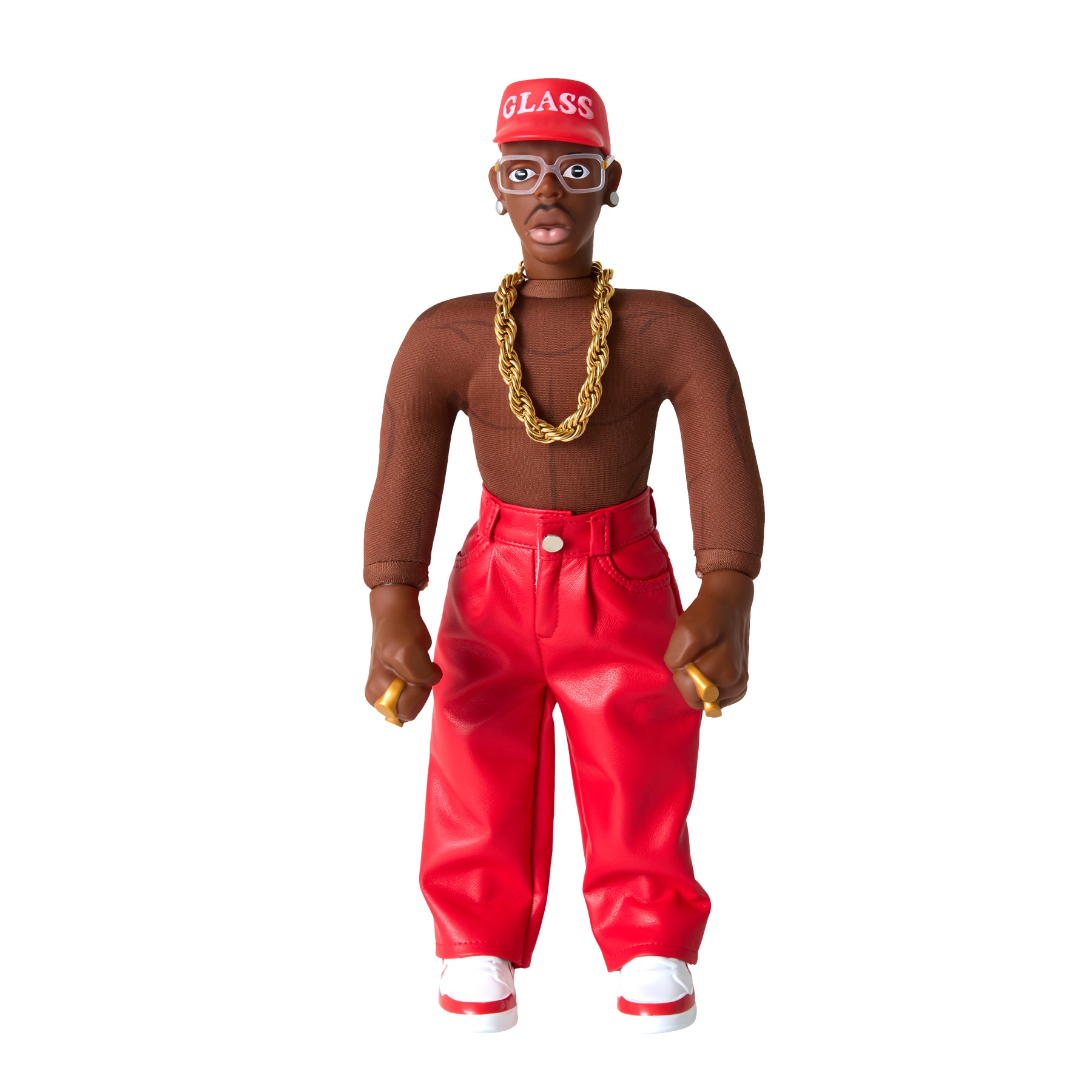 A collectible doll of a Tyler, The Creator wearing a red cap with 'GLASS' in white, a chunky gold chain, red pants, and white sneakers, isolated on a white background.